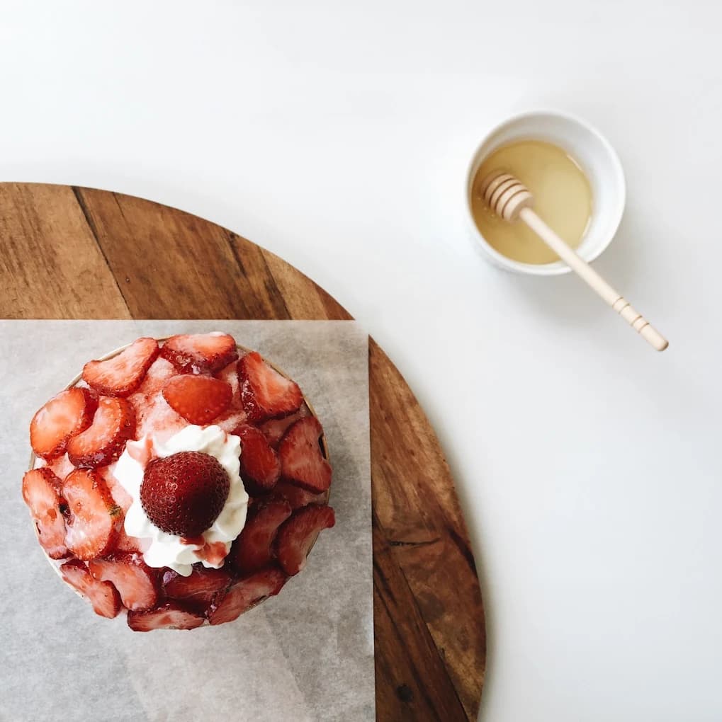 Strawberry bingsu at Snowy Village, topped with fresh strawberries and whipped cream